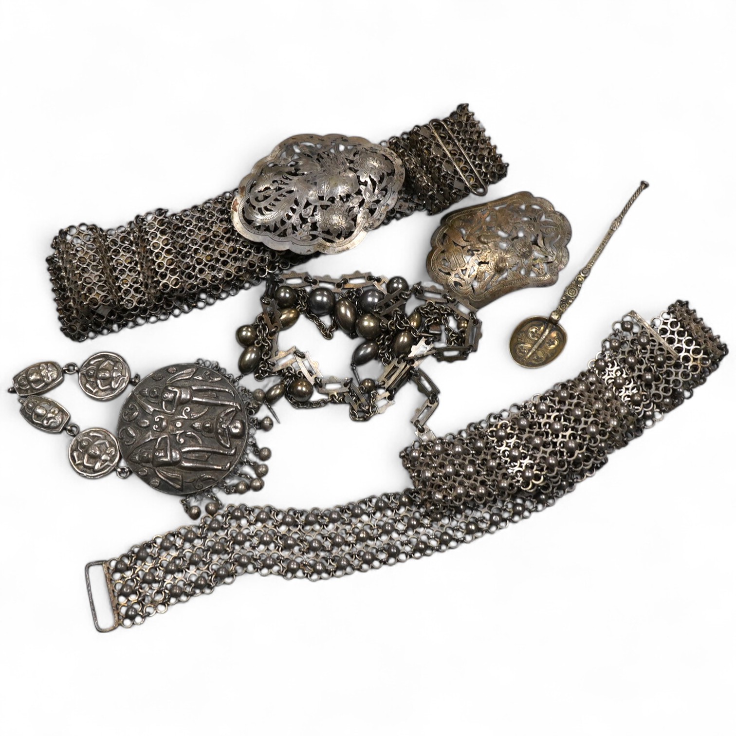 A collection of accessories and a silver spoon, comprising: a Victorian necklace, second half 19th century, composed of a series of links suspending graduated chain festoons and spherical and oval links with pointed pend